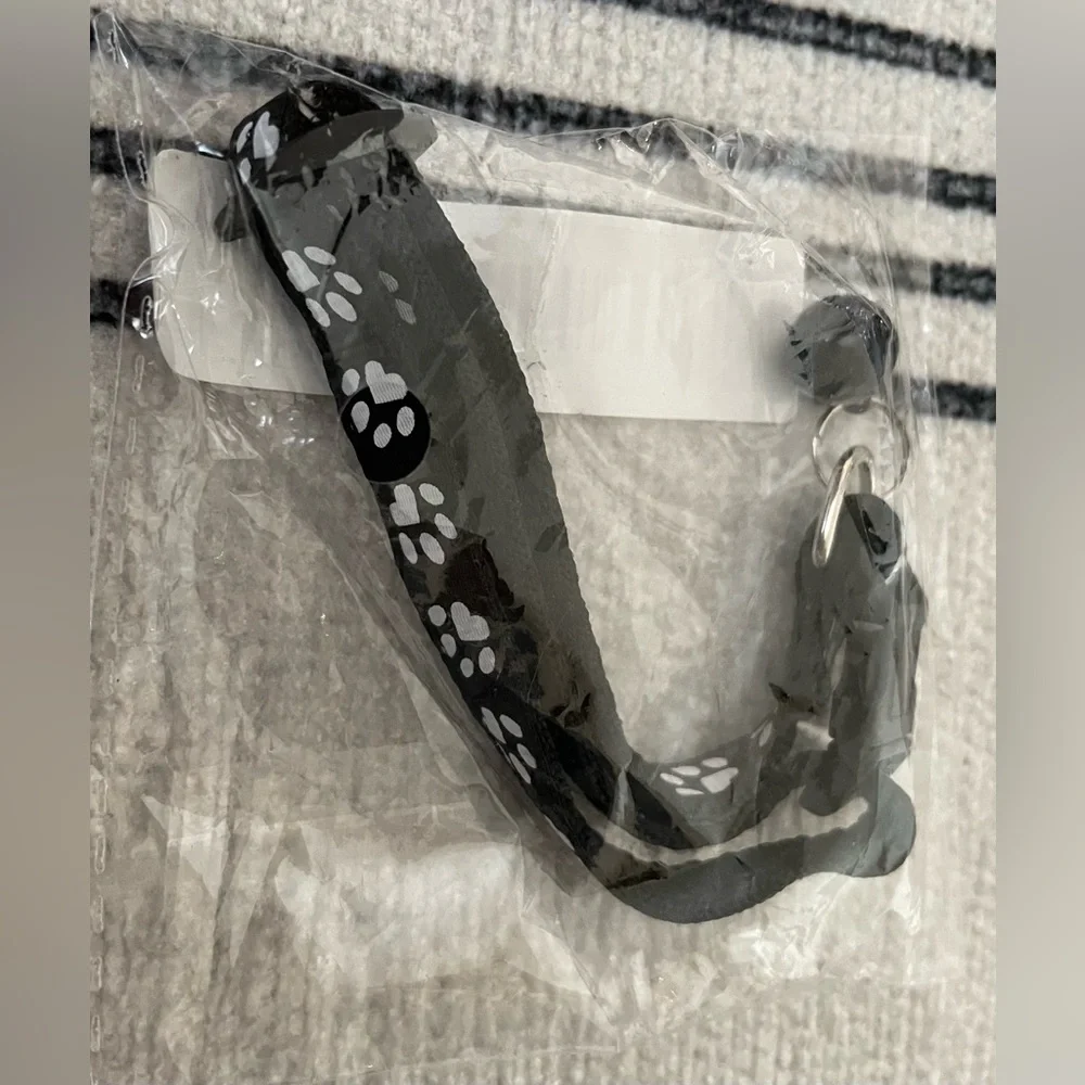 Collar with White Paw Print Pattern and Matching Bell and Buckle